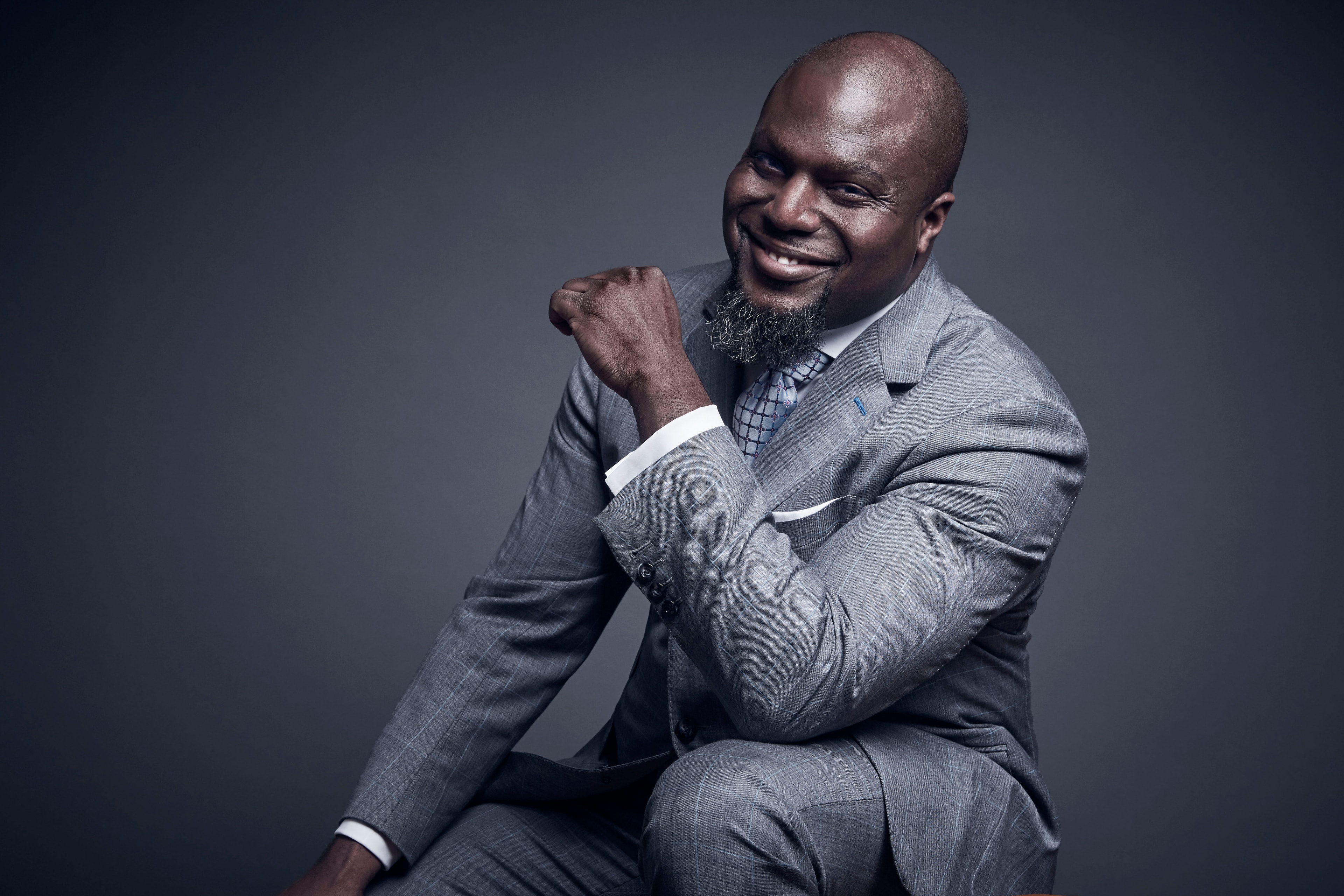 Professional headshot — grey suit